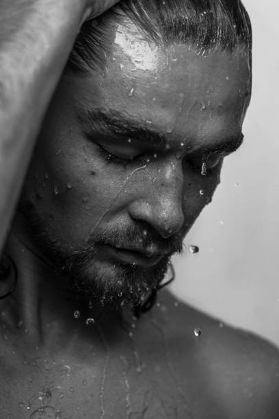 istock Beautiful male studio portrait with water 1648530450