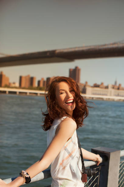 istock Smiling woman at urban waterfront 164853178