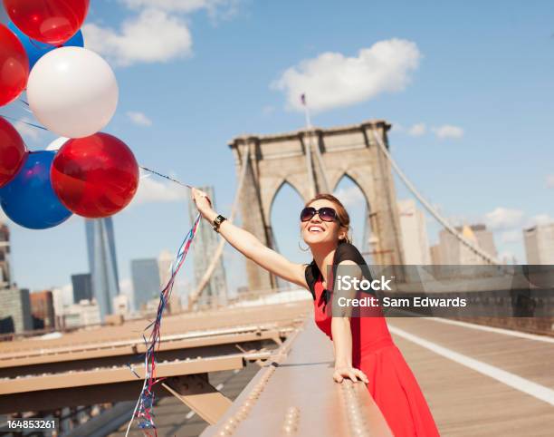 Woman With Bunch Of Balloons On Urban Bridge Stock Photo - Download Image Now - Balloon, New York City, 30-34 Years
