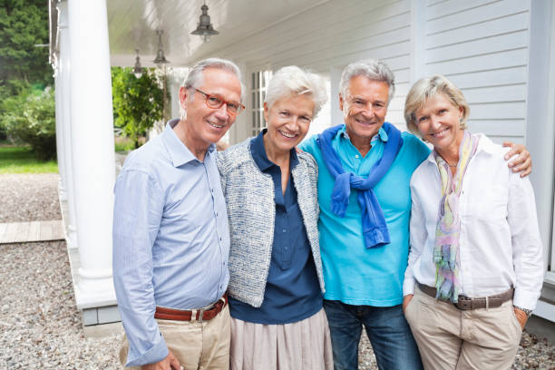 istock Friends standing together outside house 164853394