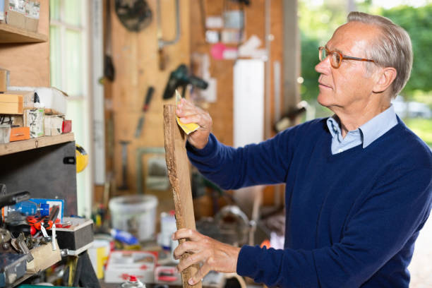 istock Man sanding wood in garage 164853644