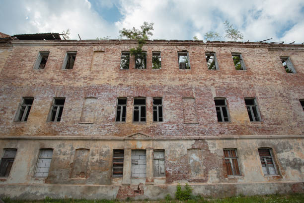 istock Old abandoned brick high rise building 1648547659