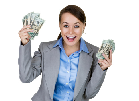 Excited businesswoman holding money 