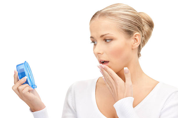 istock woman holding alarm clock 164856046