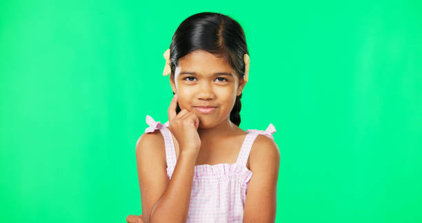 istock Thinking, green screen and idea by child with a question feeling excited, thoughtful and isolated in studio background. Planning, girl and joyful kid is happy, curious and planning expression 1648577080