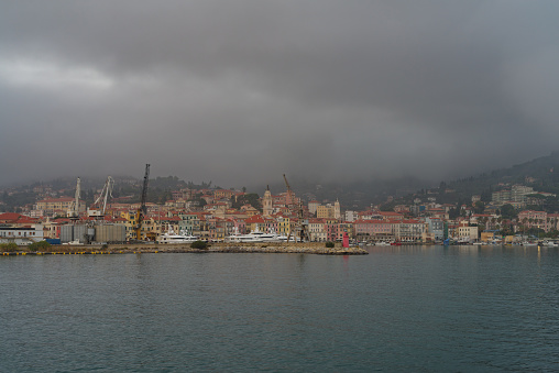 Imperia Oneglia ancient harbour, view from the sea on a rainy day, Italian Riviera, Liguria region
