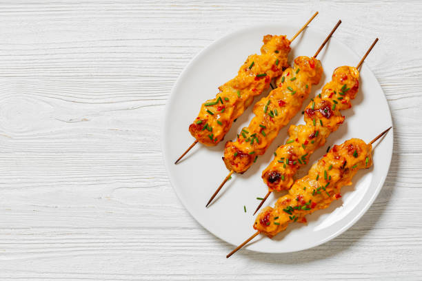 istock Bang Bang Chicken Skewers on plate, top view 1648585348