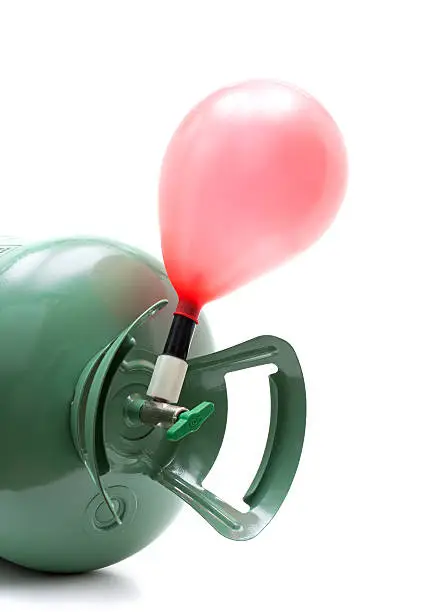 Helium gas cylinder and balloon isolated on white background.