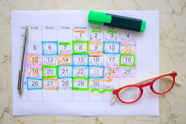 Calendar with business appointments,pen and spectacles, monthly schedule