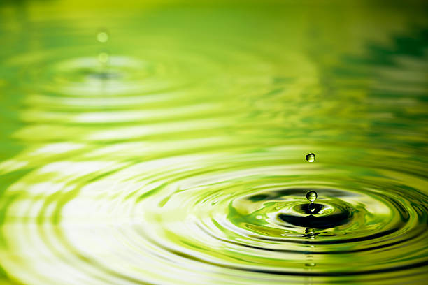 Freeze frame photography of drops falling into water. As is - some clean up only.
