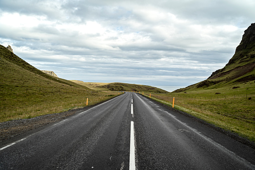 beautiful road in iceland with cloudy sky