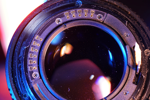 camera lenses on the mirroring black background.