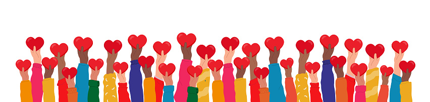 Hands raised up hold hearts, share compassion and hope with those in need.Multinational palms of human hands give support and help, participate in charity organization, volunteerism and social community solidarity. Team cooperation, partnership, community, support, trust concept.