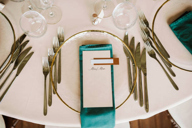 istock Table set up for a special event and a Menu list. 1648617656