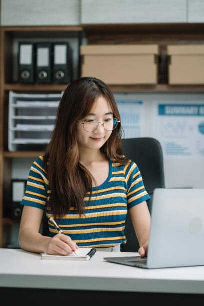 istock Learning online working concept. Businesswoman working on tablet and laptop computer, searching working in office. 1648635306