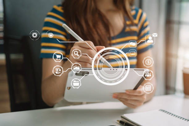 istock Women working with smart phone and laptop and digital tablet computer in office with digital marketing media in virtual icon. 1648635875