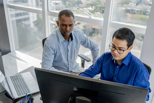istock Cybersecurity team discussing in front of a monitor screen 1648641111