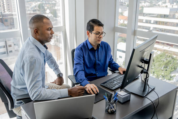 istock Cybersecurity team discussing in front of a monitor screen 1648641130