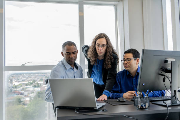 istock Cybersecurity team discussing in front of a monitor screen 1648641695