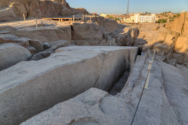 istock Tourists admiring the unfinished obelisk in a quarry at Aswan 1648655840
