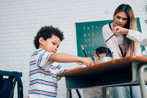 istock Happy school teacher and students having interesting engaging activities in class. 1648658046