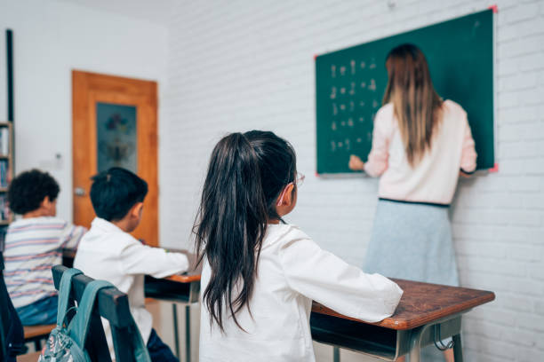 istock Happy school teacher and students having interesting engaging activities in class. 1648662930