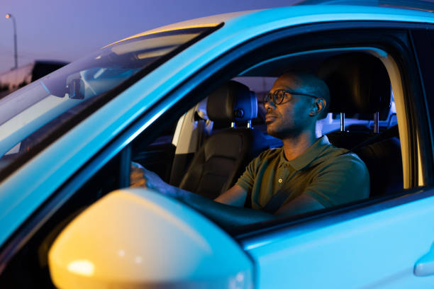 istock Man driving through the city in the night 1648663509