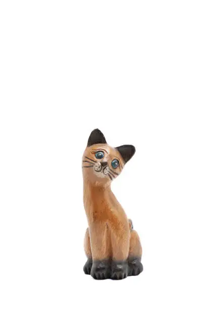 Photo of Wooden cat looking far away