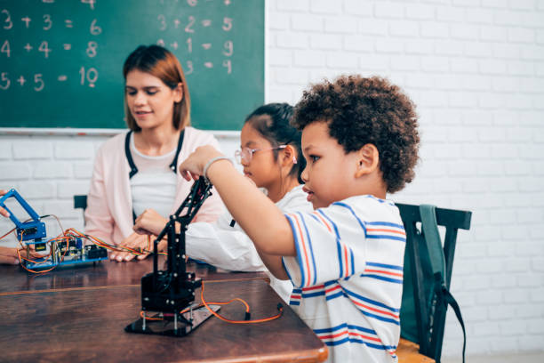 istock Happy school teacher and students having interesting engaging activities in class. 1648670275