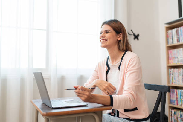 istock Portraits of beautiful smiling women relax using laptop computer technology while sitting on their desks. 1648674287