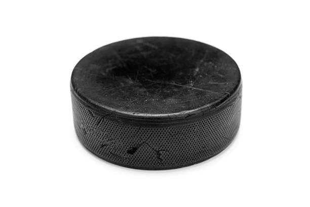 Ice Hockey Puck Ice Hockey Puck hockey puck photos stock pictures, royalty-free photos & images