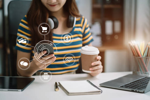istock Women working with smart phone and laptop and digital tablet computer in office with digital marketing media in virtual icon. 1648689264