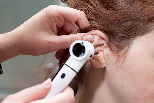 istock ear exam with otoscope 164869196