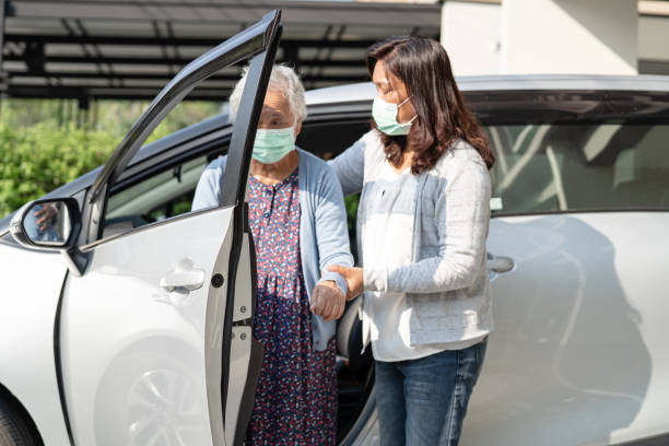 Asian senior woman patient sitting on walker prepare get to her car, healthy strong medical concept. Asian senior woman patient sitting on walker prepare get to her car, healthy strong medical concept. senior adult car nurse physical impairment stock pictures, royalty-free photos & images