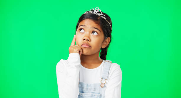 istock Thinking, green screen and child wondering with a question feeling confused, thoughtful and isolated in studio background. Planning, girl and kid contemplating, curious and planning expression 1648700692