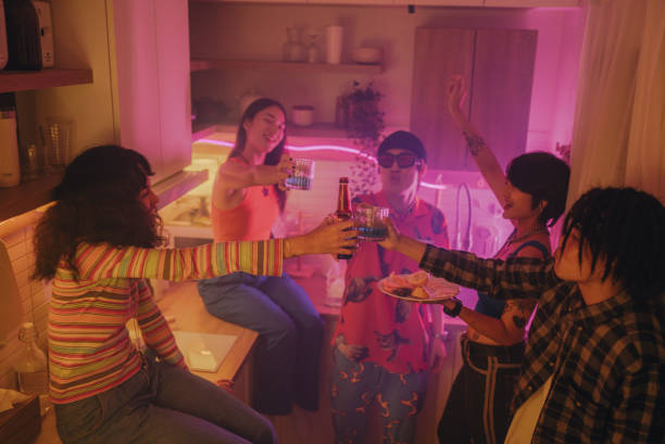 istock Multiethnic friends enjoying drinking together at a house party. 1648702842