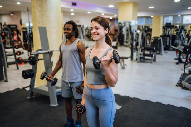 istock Friends exercising together in the gym 1648708956