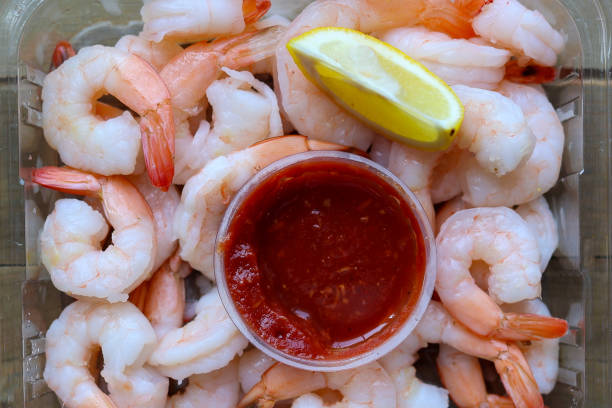 istock A plastic container full of shrimp cocktail with sauce 1648710036