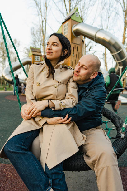 istock Happy smiling couple spend time on a playground 1648715098