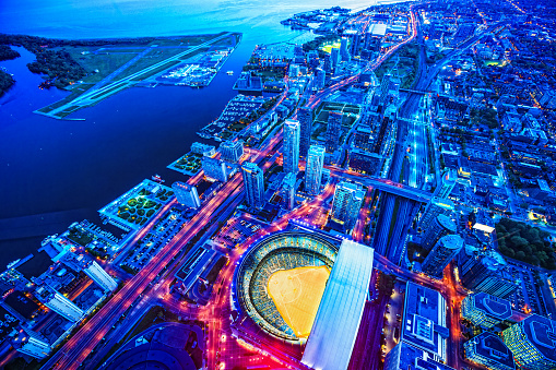 Toronto cityscape with baseball stadium at dusk, Ontario, Canada.