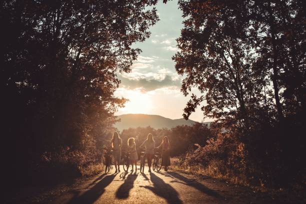 Female friends exploring the nature and enjoying in the sunset