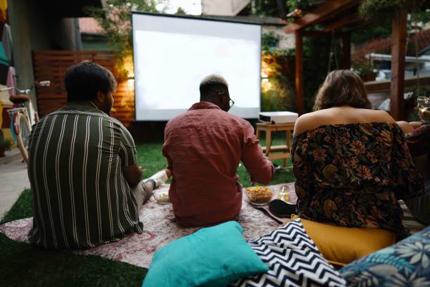 istock People watching movies on a projection screen 1648771956