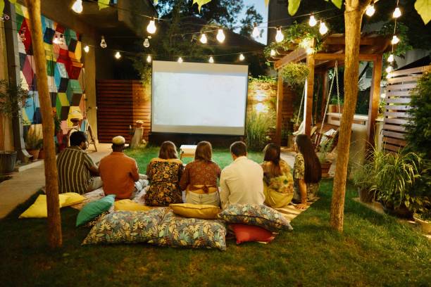 istock Movie night on a projection screen in the backyard 1648777371