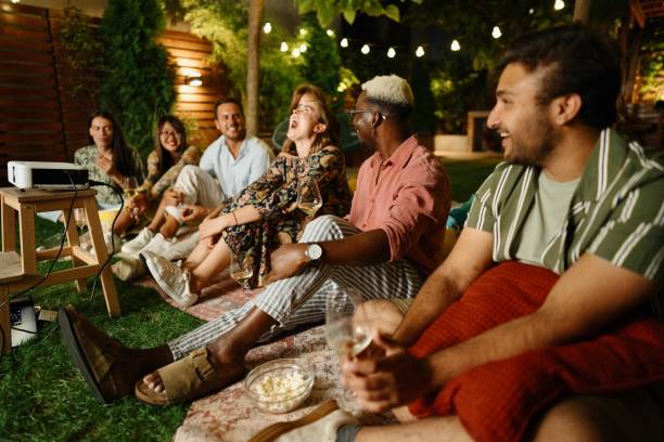 istock Friends smiling and having fun while watching movies 1648780176