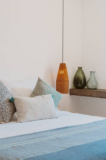 istock Rustic bedroom interior design with pillows on bed and decorative wood bed close-up 1648792651
