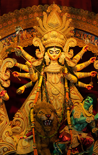 Howrah, West Bengal, India- 3rd October, 2022 : Beautiful idol of Goddess Durga, decorated with ornaments, being worshipped during Durga Puja festival, biggest festival of Hinduism.