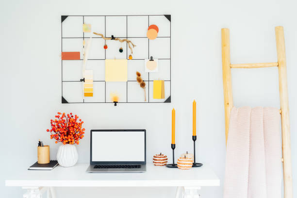 istock Home office desk with open laptop mockup, grid mood board with fall colors palette and seasonal decor like candles, flowers, pumpkins, plaid. Autumn inspiration and cozy mood. Hygge home fall decor 1648794840