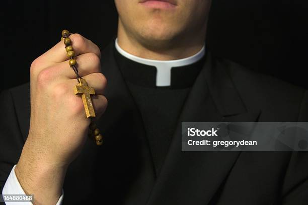 Young Priest Praying Stock Photo - Download Image Now - Priest, Catholicism, Rosary Beads