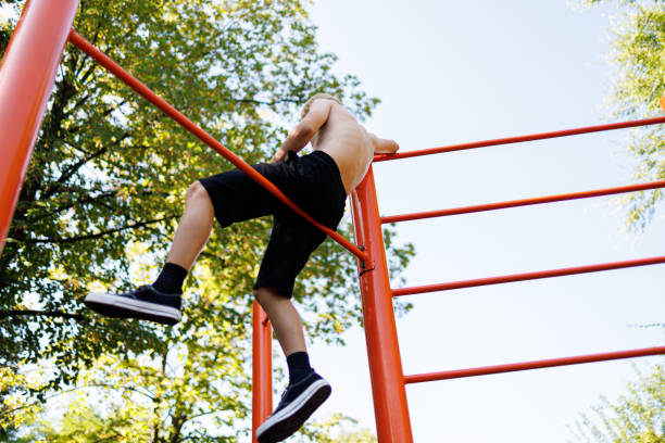 istock Street workout on a horizontal bar in the school park. 1648820291