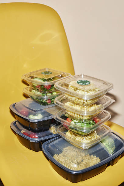 istock Food delivery order in plastic containers on yellow 1648836016